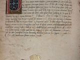 an old book with a drawing of a sun on it