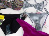 a lot of bikinis that are on a table