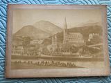 an old picture of a picture of a city with a horse drawn carriage