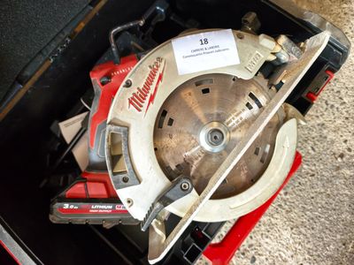 a circular saw that is sitting in a tool box