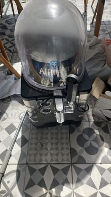 a small machine that is sitting on a tiled floor
