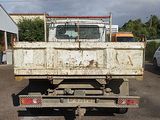 a white truck that is parked in a parking lot
