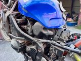 a close up of a motorcycle with a blue helmet on it