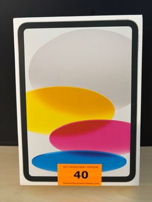 une image représentant une boîte blanche ornée de cercles colorés