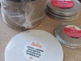 a stack of plates sitting on a counter next to a container