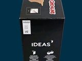 a black box with a picture of a man holding a camera