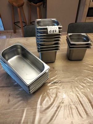 many pans on the table ready to be cooked