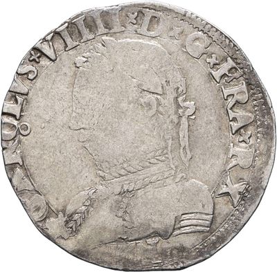 a close up of a coin on a white background
