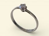 a close up of a diamond ring on a white background