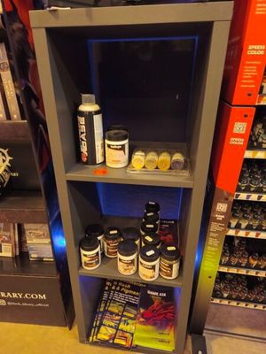 a shelf that has various items on it in a store