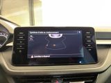 the dashboard of a car with a gps device in the center