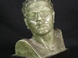 sculpture of a bust of a man on a black background