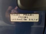 a person taking a picture of a car ' s rear view mirror