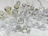 a lot of glass objects that are on a table