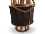 a basket with a handle and a rope around it