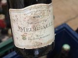 a bottle of wine that is being held by a person