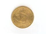 a close up of a gold coin on a white surface