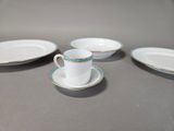 four plates and a cup on the table