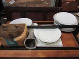 a tray with plates and bowls on it on a table