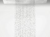 a close up of a shower head with water pouring from it