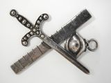 a pair of scissors and a knife on a white surface