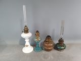 quatre types de bougies différents sur la table