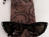sunglasses in a pouch and a pair of sunglasses on a table