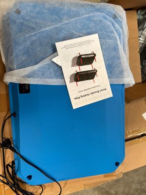 a blue box with a blue sheet of paper on top of it and a blue box with a blue sheet of paper on top of it