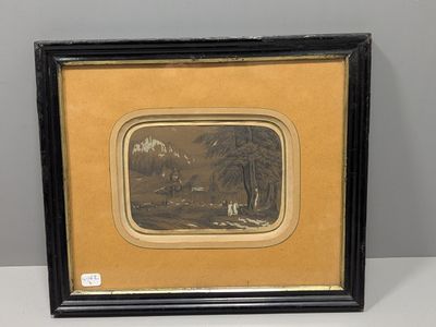 un vieux cadre contenant la photo d'un homme et d'une femme dans un paysage