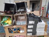 a pile of boxes with shoes and other items in them
