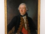portrait d'un homme vêtu d'un manteau noir et d'une écharpe rouge
