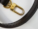 a close up of a black leather belt with a gold buckle