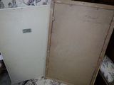 two old refrigerators sitting next to each other on the floor