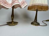 two lamps that are sitting next to each other on a table