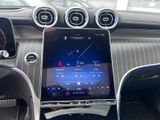 the dashboard of a car with a tablet on the dashboard