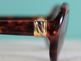 a close up of a pair of glasses on a table