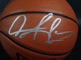 a close up of a basketball with a signed ball on it