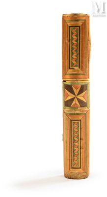 an image of a tall wooden object with a design on it