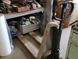 a room with a lot of boxes and tools on the shelves