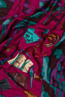 the fabric is multicolored and has a pattern of horses on it