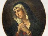 an oval painting of a woman with a veil on her head