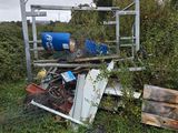 a pile of junk sitting in the middle of a field