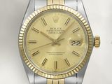 une image représentant une montre Rolex dorée et argentée sur fond blanc
