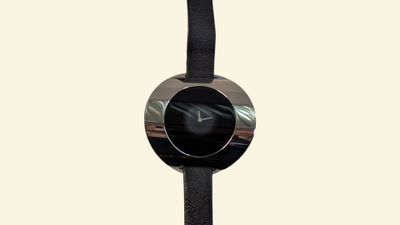 an image of a black and silver watch with a black band