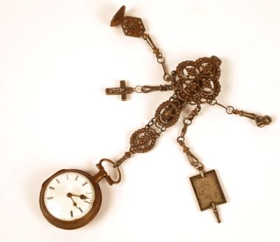 a clock that is attached to a chain with a key