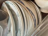 a pile of plates and pans stacked on top of each other