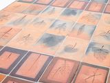 a tile table with many different designs on it