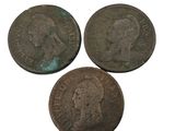 three coins of the same type are shown on a white background