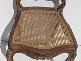 an image of a chair that is sitting on a white wall
