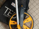 a black bag with a yellow wheel and a black bag with a black handle